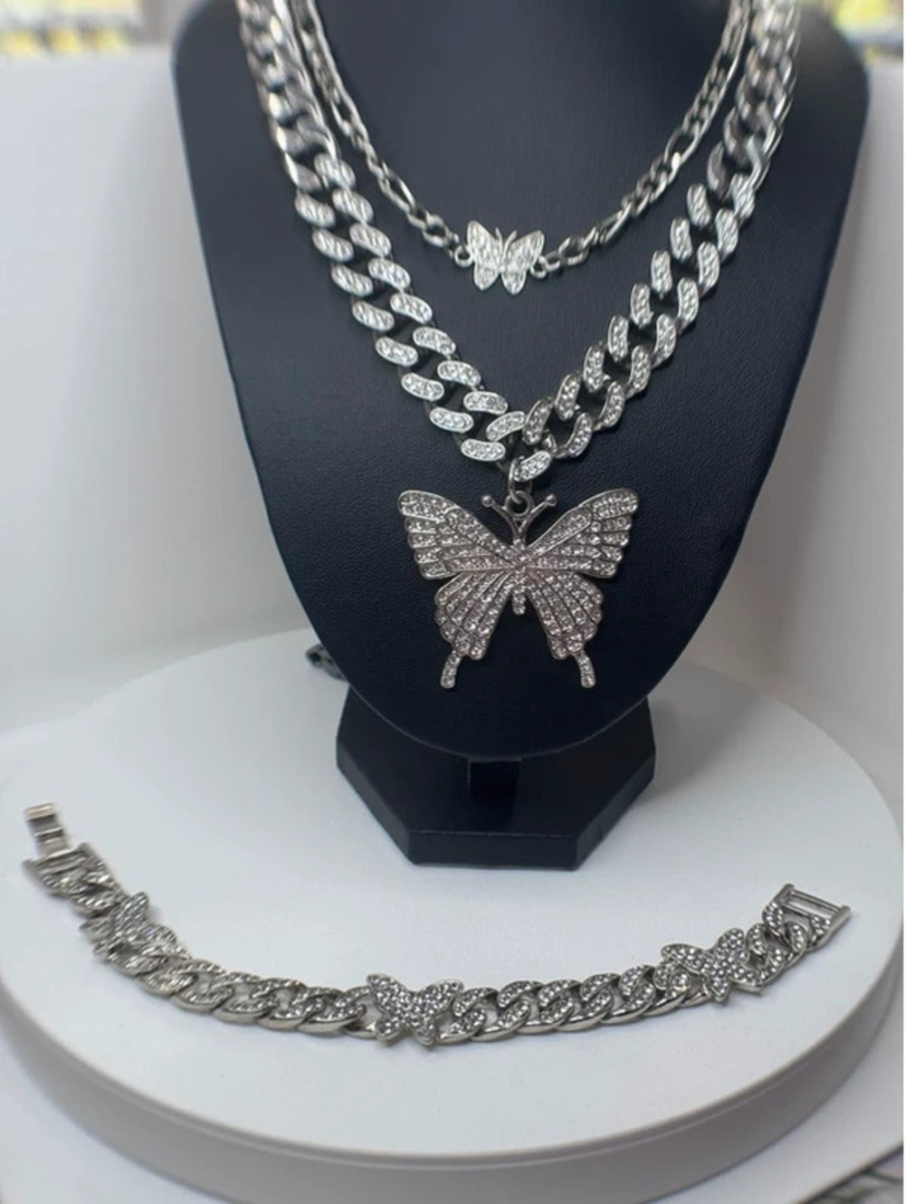 3 piece set silver tone butterfly jewelry. 2 necklaces and 1 bracelet